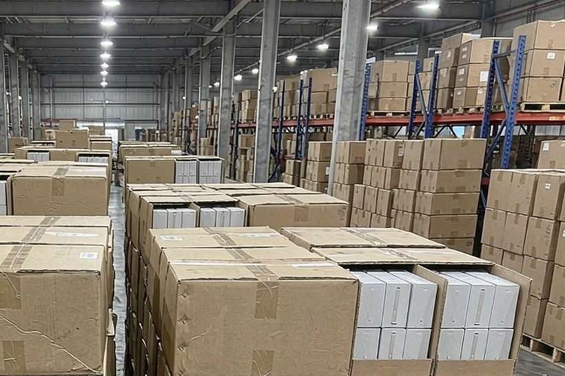 Restocking Kafficarat pods — container load